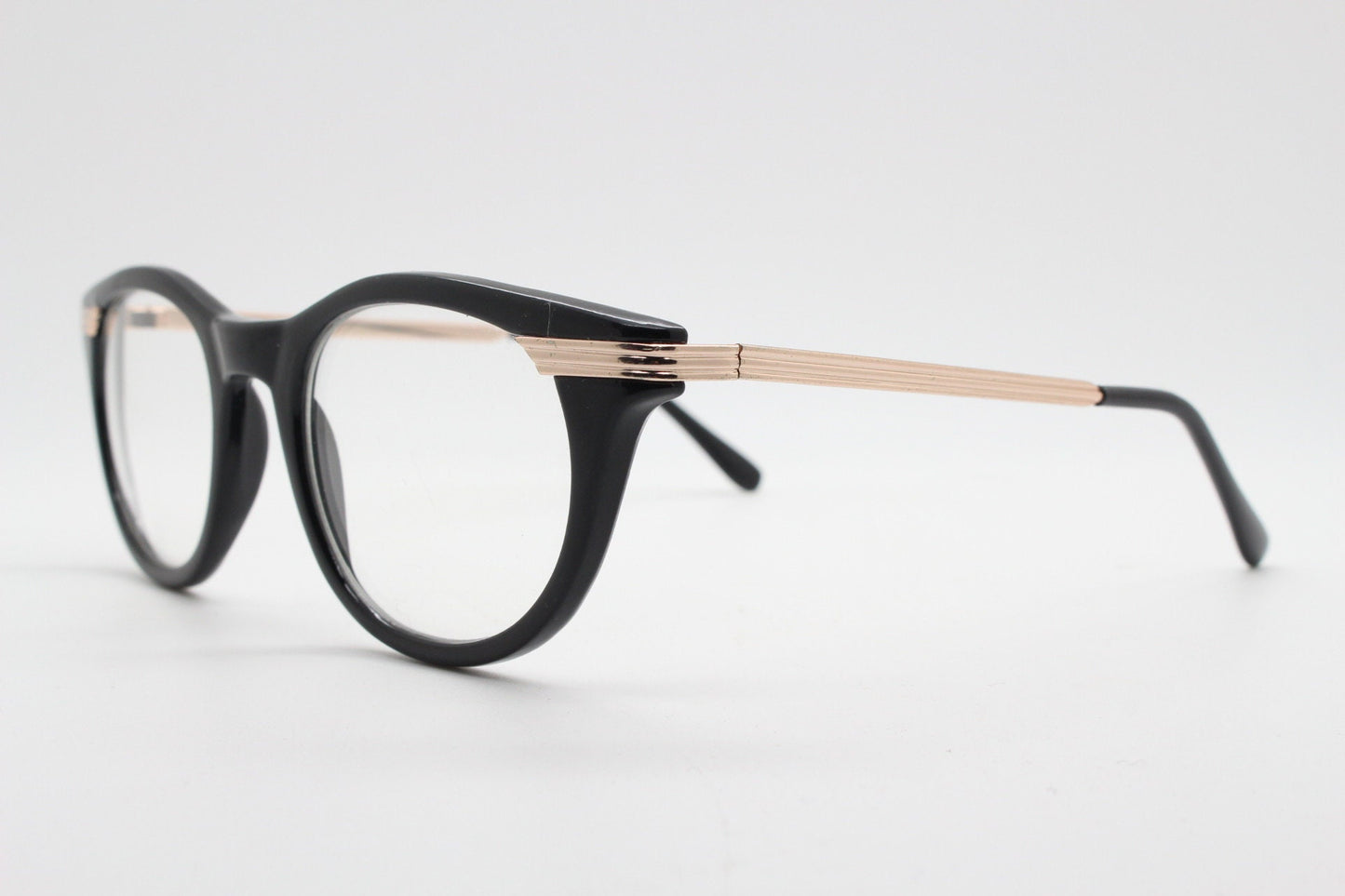 90s vintage cat eye glasses in black with gold metal arms. 50s, 60s style cateye prescription optical frames. Clear lens eyeglasses. RX