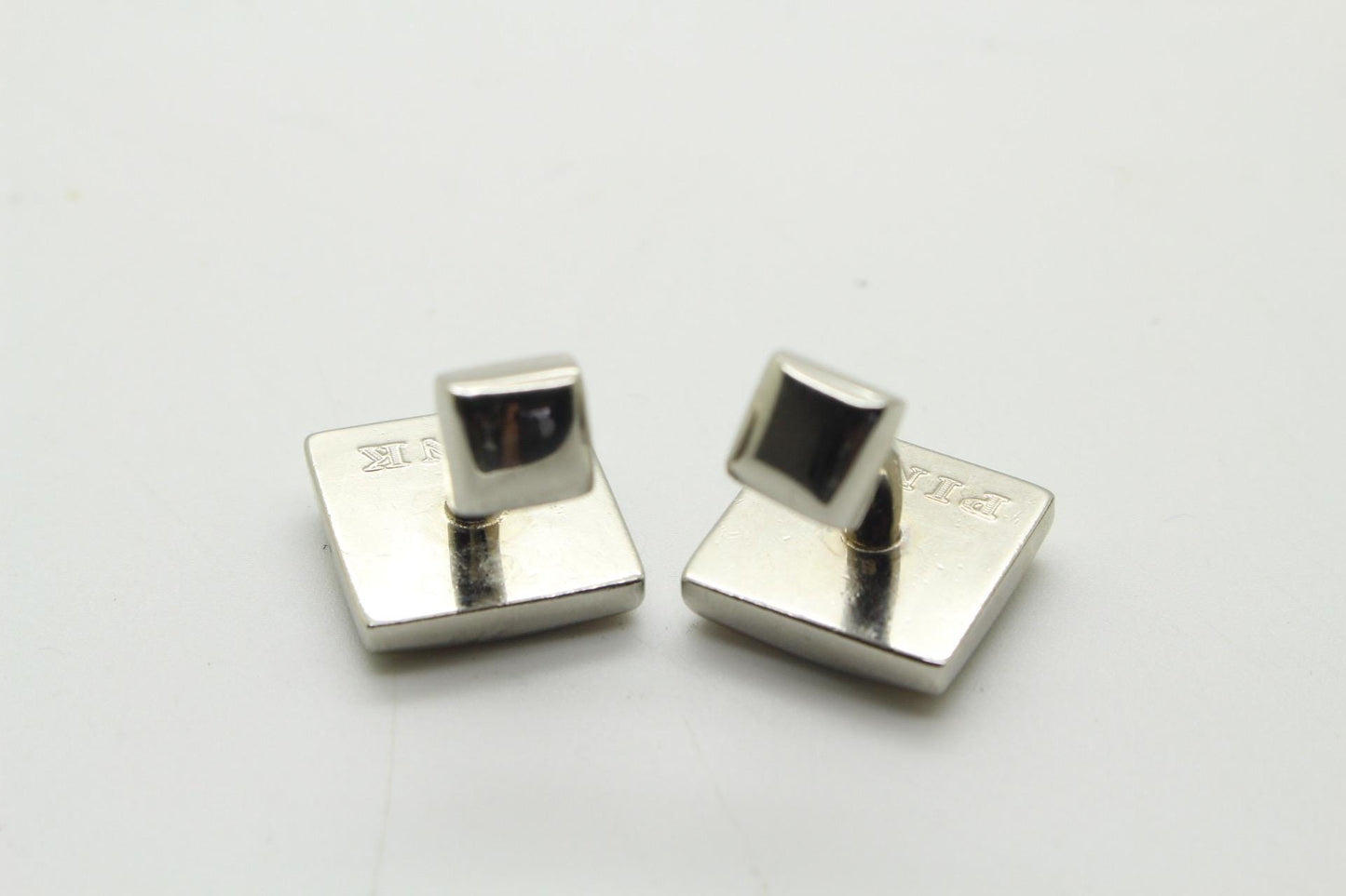 Thomas PInk vintage square cuff links made in England. Solid metal construction with enamel stripes in green and yellow tones. Unused NOS