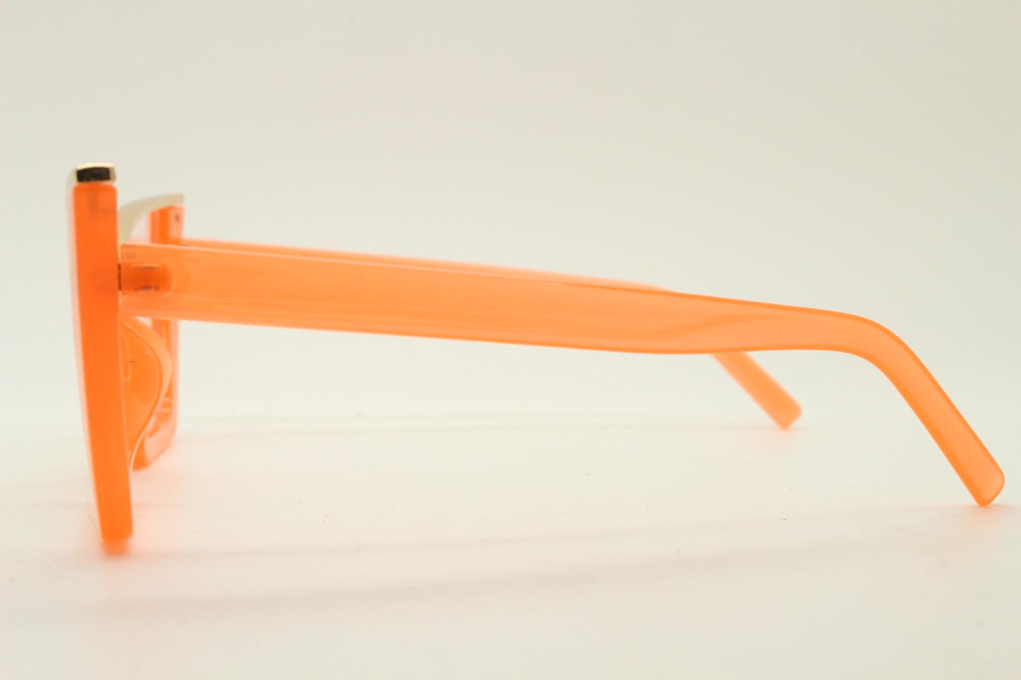 Dynamic pointed cat eye glasses. Transparent thick orange optical frame with gold metal 'owl' brow. and clear lenses. Vintage. Prescription