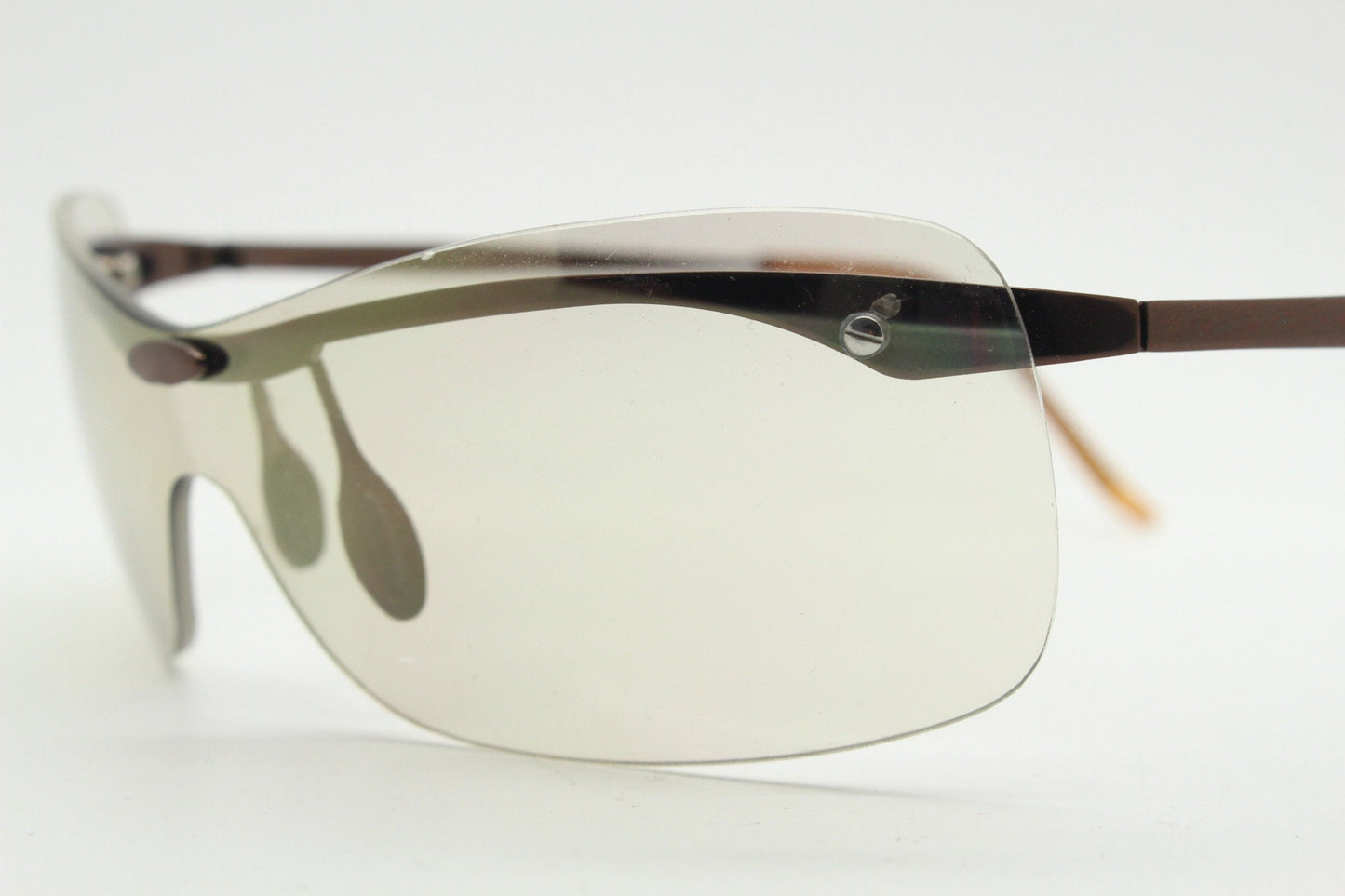 Y2K vintage visor sunglasses. 2000's wrap around sport shield design. Brown chrome brow with light tone lens. NOS 00's. 90S