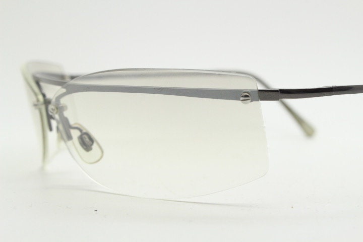 Y2K vintage wraparound sunglasses. Sick fashion grail half frame in grey chrome with extra light tone curving mirrored lenses. 2000's NOS