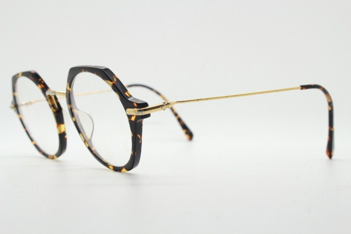 Kaleos hexagon eye glasses model Trevethyn made in Italy. Amber tortoise acetate optical frames with gold arms. Prescription eyeglasses. RX