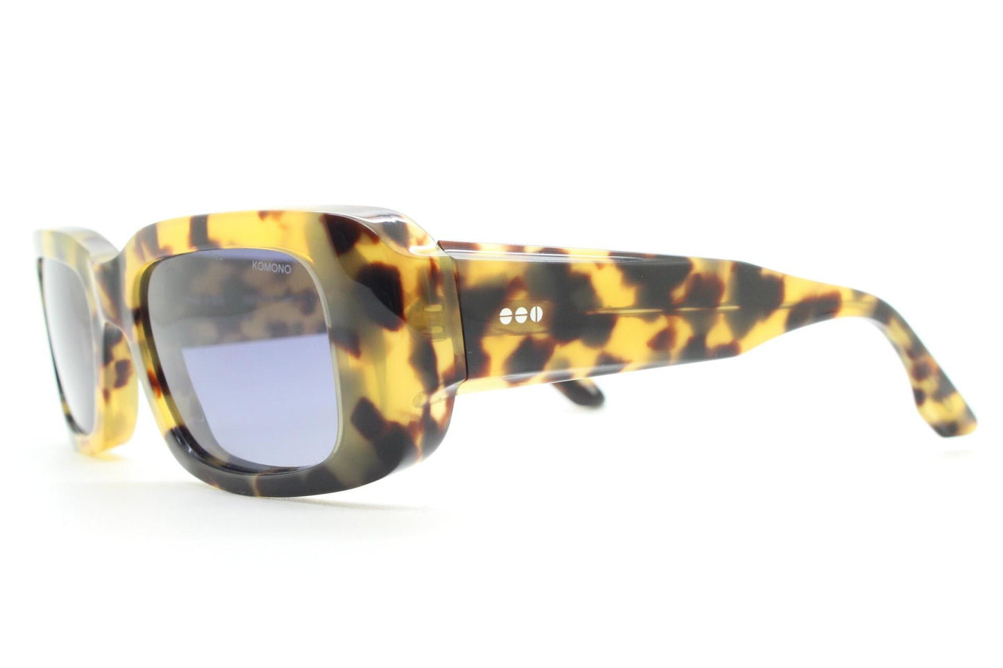 Komono chunky rectangular sunglasses model The Wes. Thick framed honey tortoise eco acetate with curved back 'goggle' sides and tall arms.