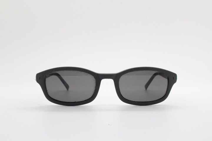 Dolce and Gabbana gum sunglasses made in Italy. Mens 90s vintage innovative flexible grey rubber frame with black lenses