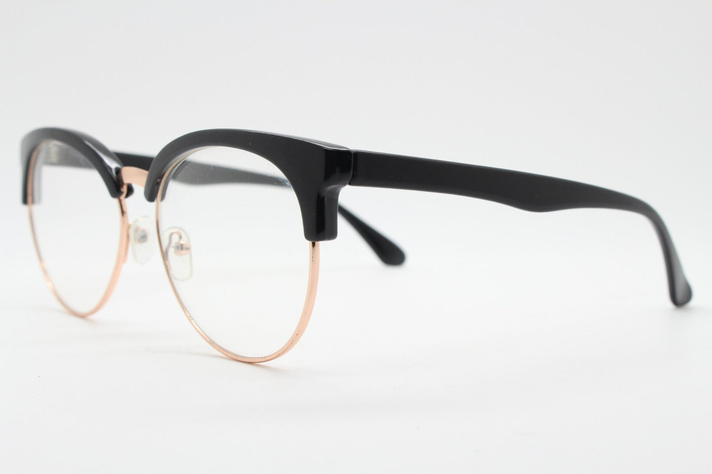 90s vintage modified cat eye glasses. Black gloss browline half frame eyeglasses with gold underwire. 50s, 60s design cateye. NOS