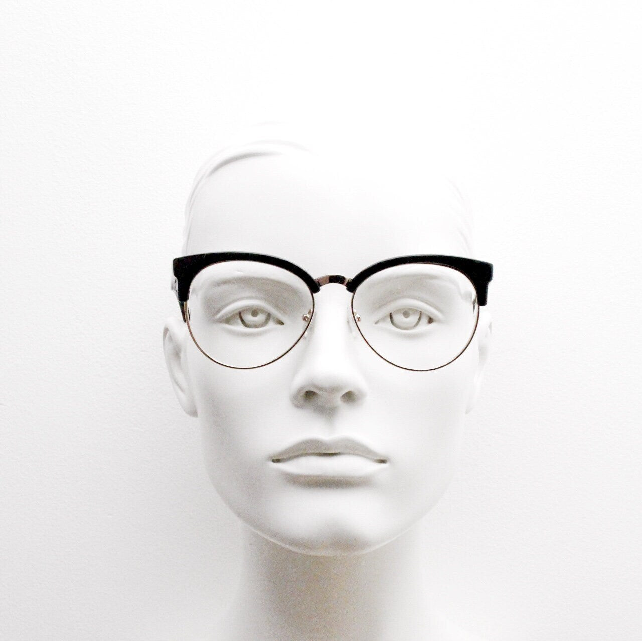 90s vintage modified cat eye glasses. Black gloss browline half frame eyeglasses with gold underwire. 50s, 60s design cateye. NOS