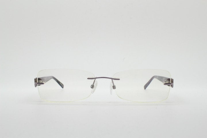 Givenchy rectangular frameless eye glasses made in Italy. Minimal optical frame with marbled brown arms. Prescription RX spectacles. Vintage