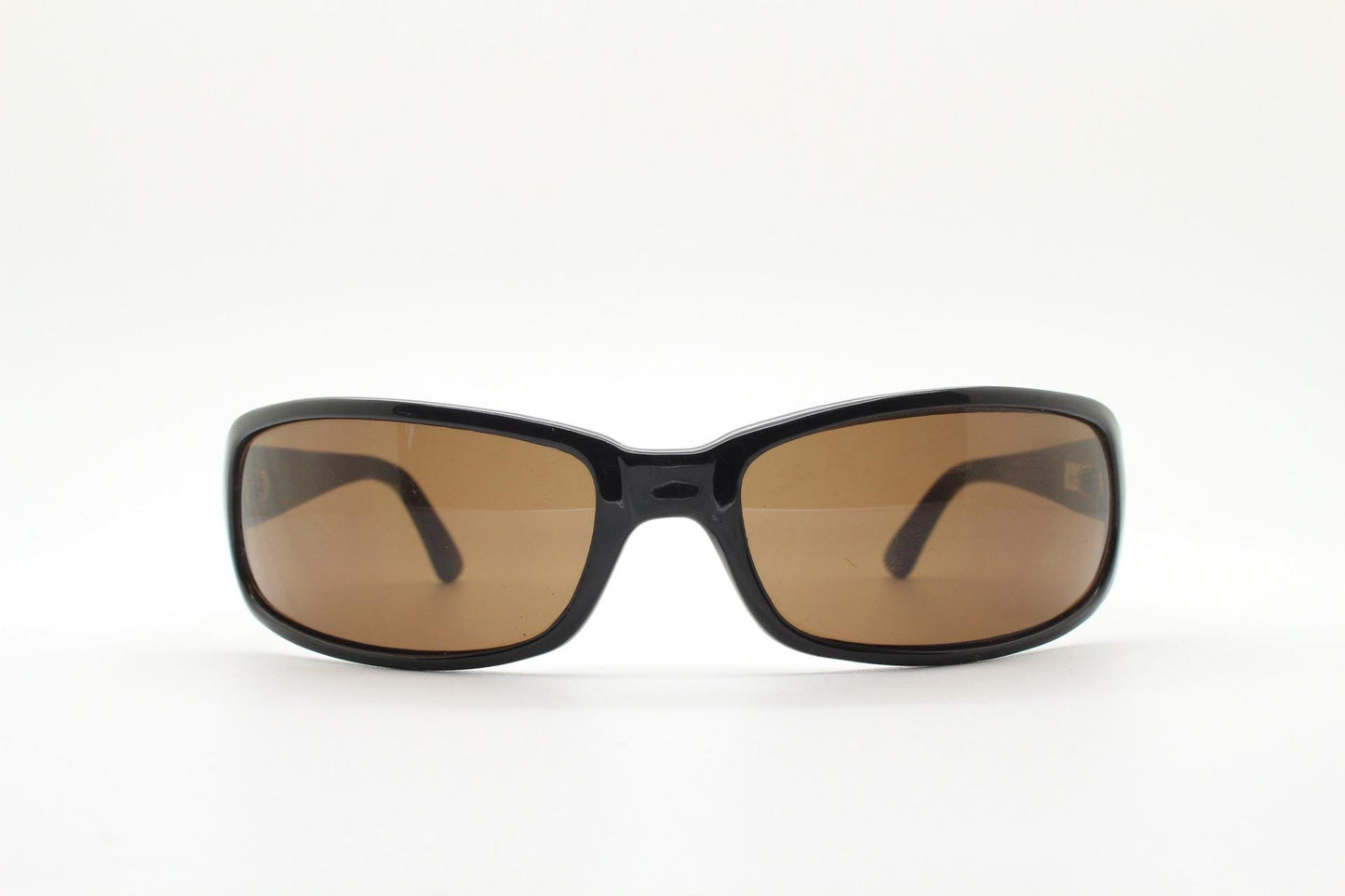 Y2k vintage wrap around rectangular sunglasses. Low profile curved black gloss frame with plain brown lenses. 2000's bug eye. NOS