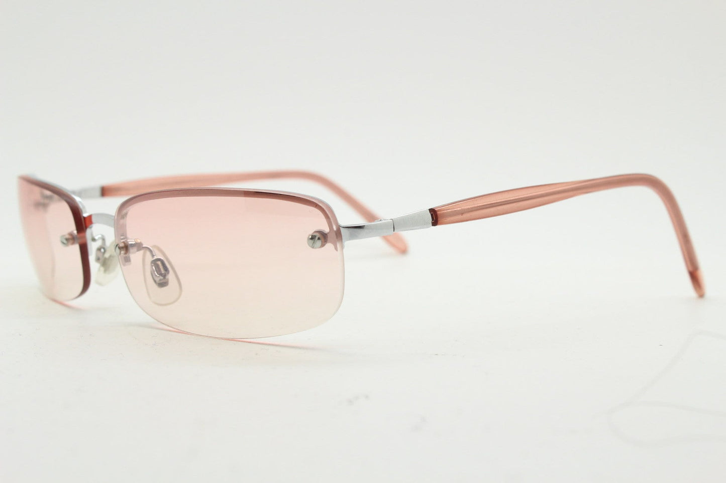 Y2K vintage wrap around rectangular sunglasses. Half frame in sharp chrome with extra light tone pink lenses. Rave 2000's. 00's NOS