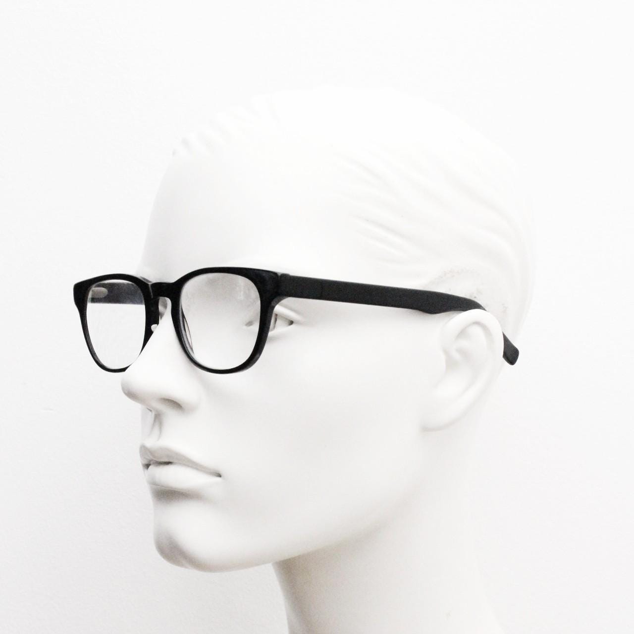 Andi Black rectangular horn rim eye glasses. Black gloss 40s design acetate optical frames with keyhole bridge. Prescription RX spectacles