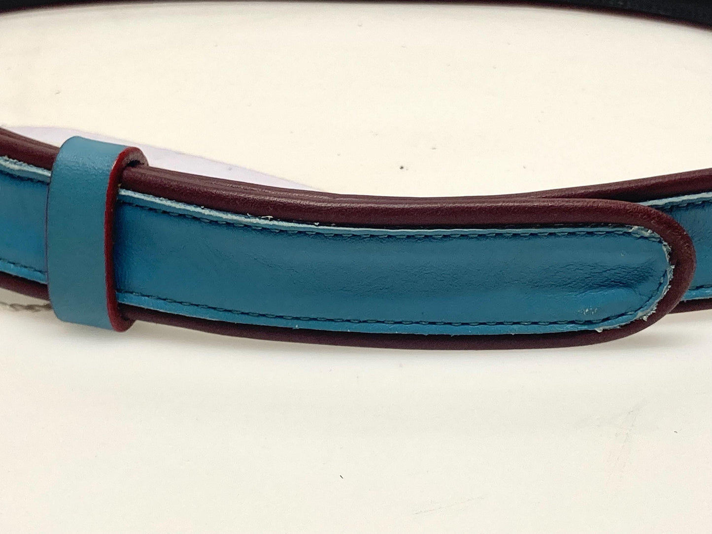 Moschino 90s vintage womens dress belt in oxblood and blue genuine leather with oval enamelled metal buckle. Made in Italy. BNWT. NOS