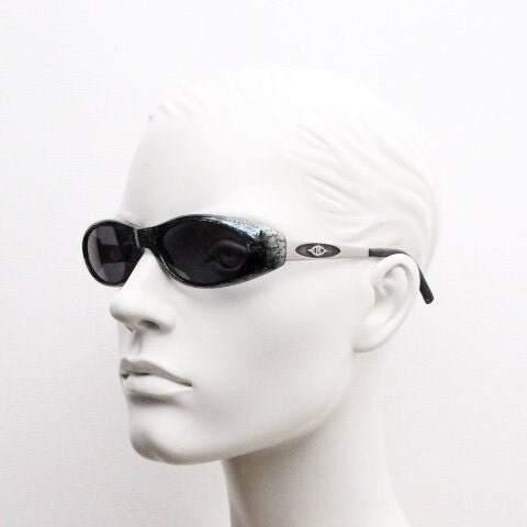 Killer Loop Shedevil 90s vintage shield sunglasses made in Italy. Low profile wrap around design with unique metallic print. One off sample