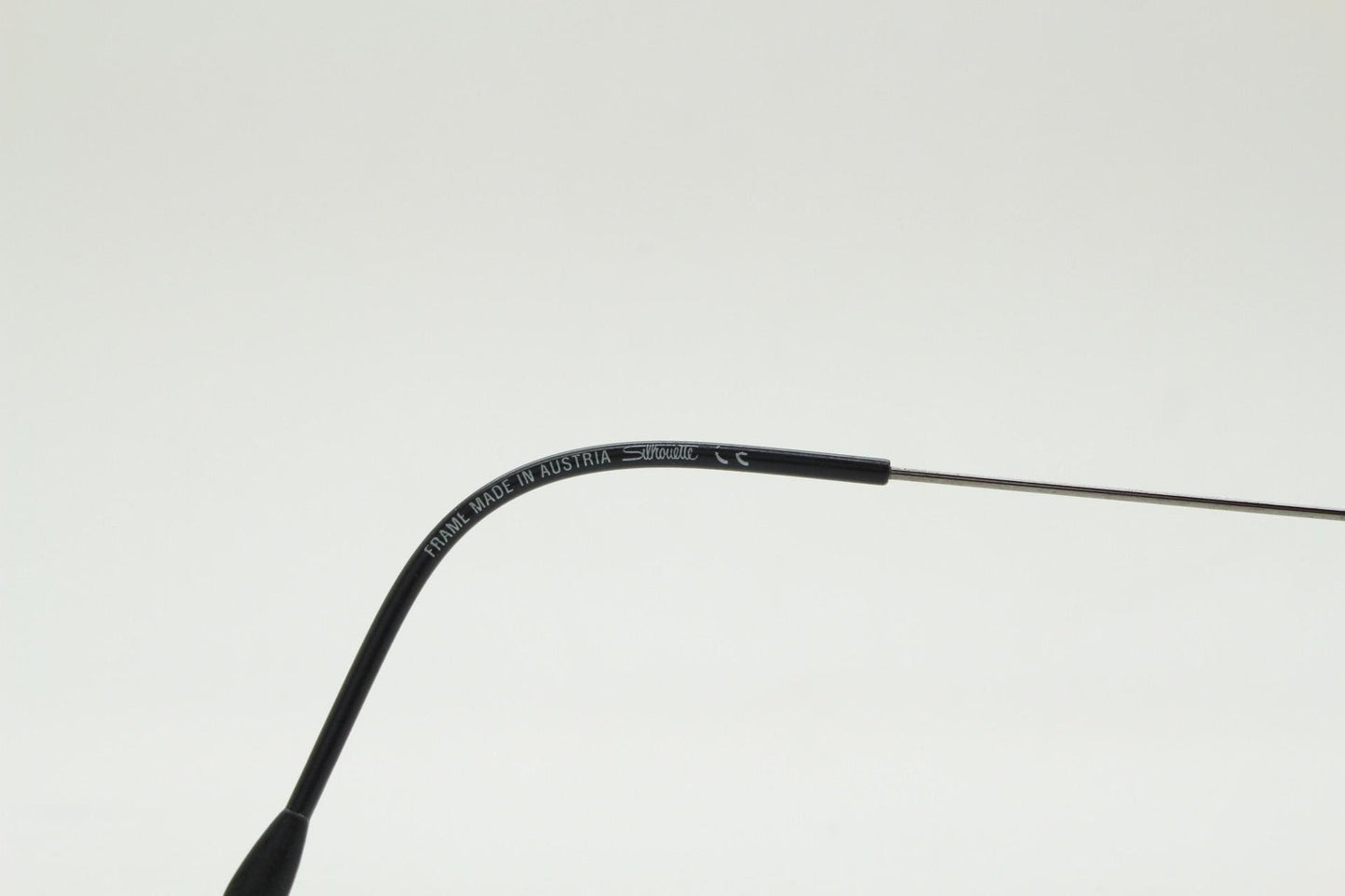Silhouette vintage oval frameless eye glasses made in Austria. Minimal lightweight brown chrome optical frame. Prescription spectacles