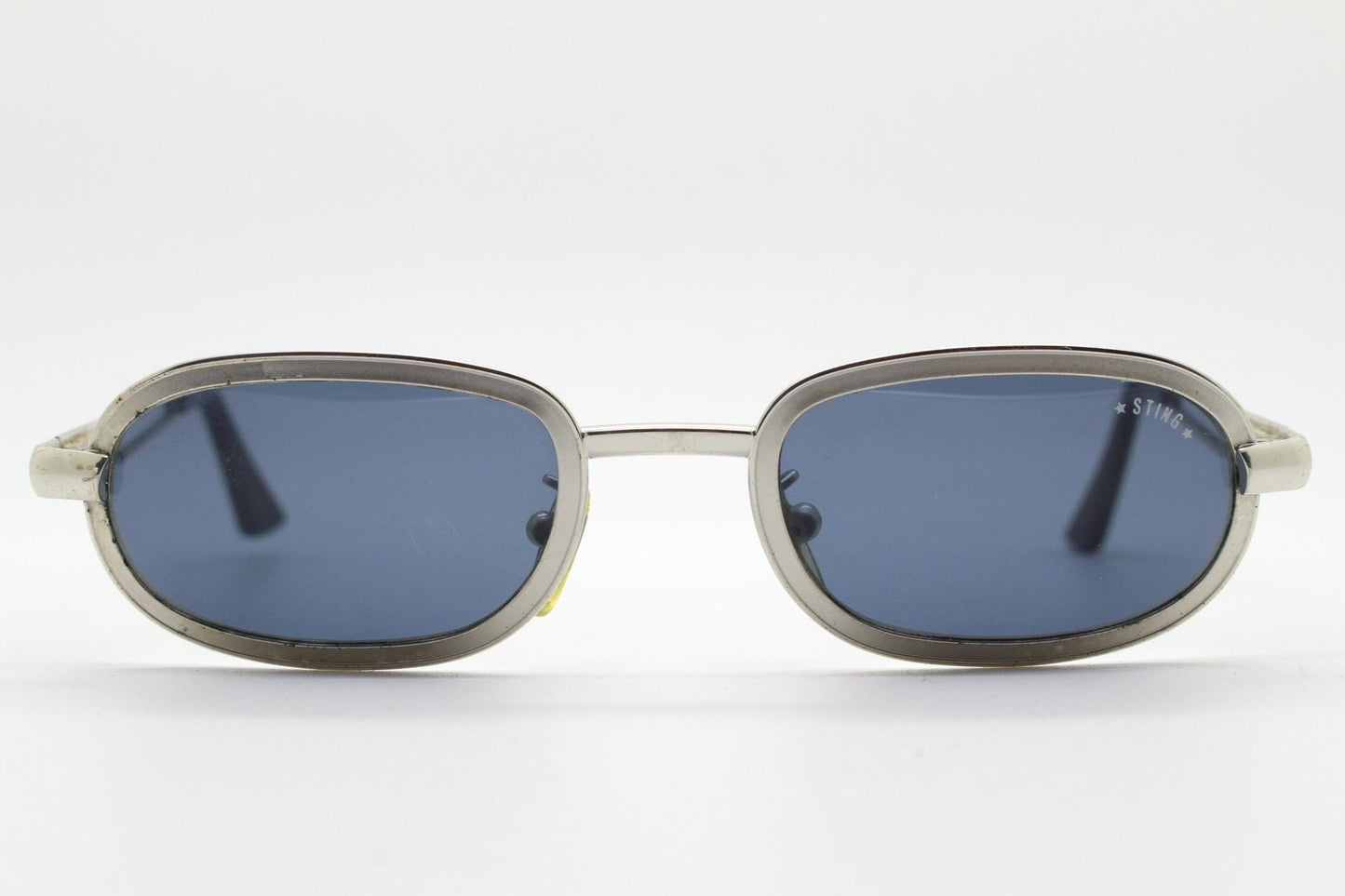 Sting 90s vintage oval sunglasses. Minimal 'Industrial tech' style in slightly small proportions that's quirky but in a quality finish