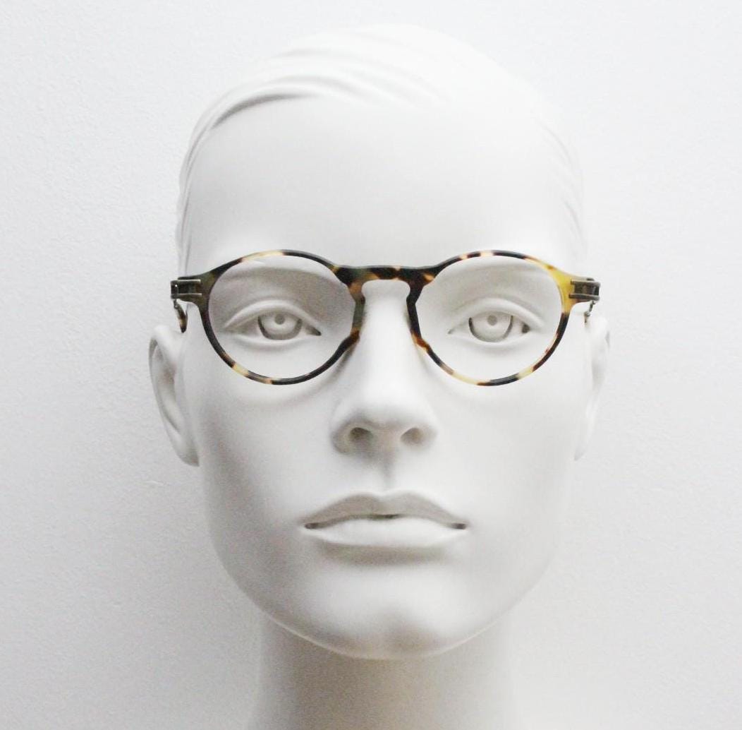 90s vintage oval eye glasses by No Limits. Honey tortoise optical frames with dynamic zig zag arms. Prescription RX spectacles. NOS