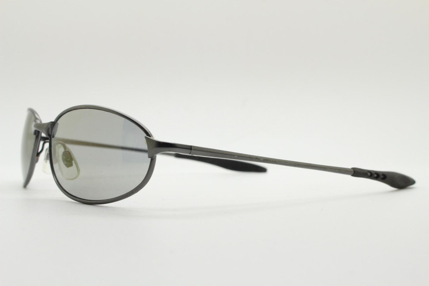 90s vintage oval small  bug eye sunglasses. Satin finish frame in gunmetal with straight spear arms. Y2K. 2000s. Unworn NOS