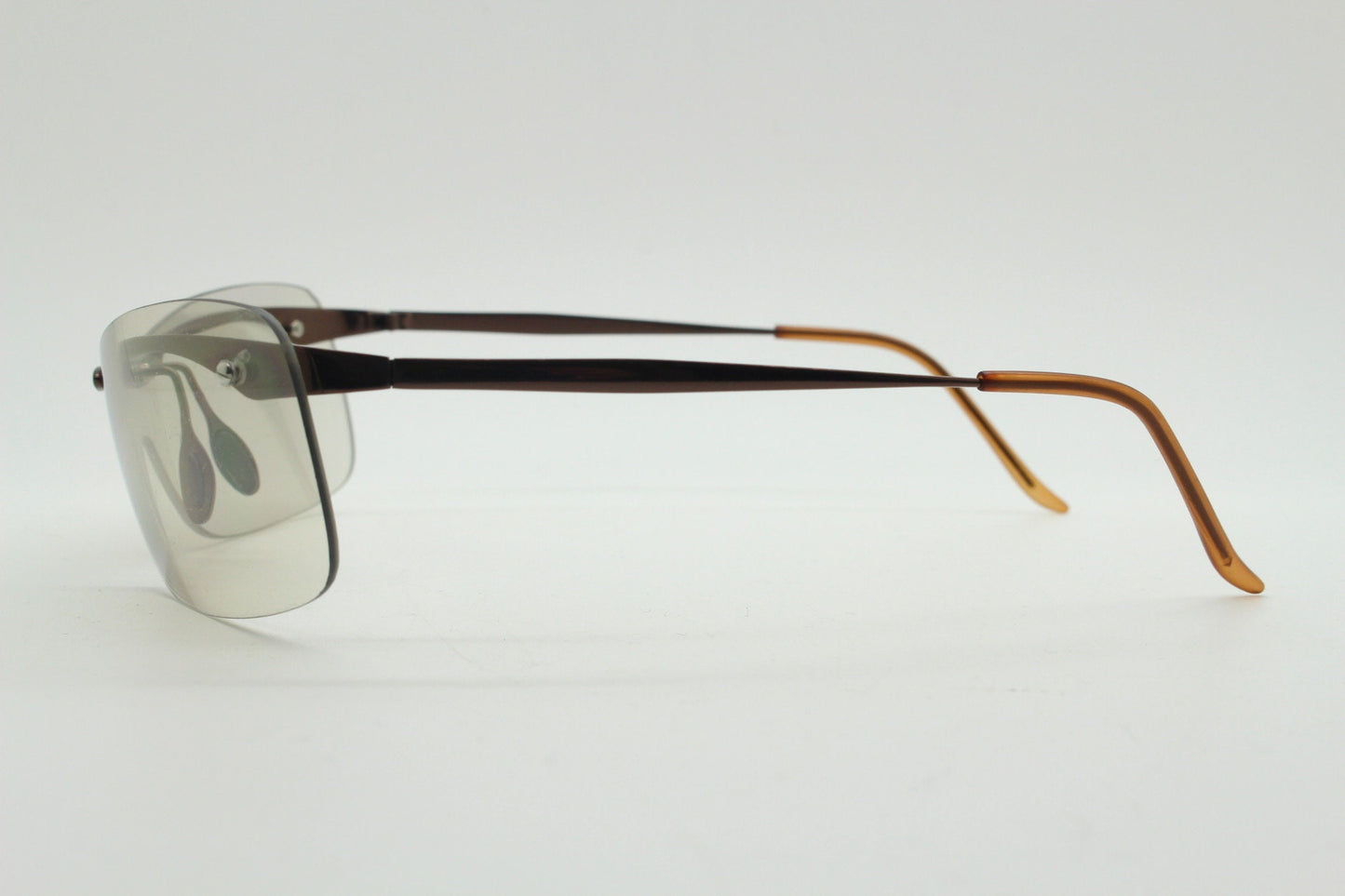 Y2K vintage visor sunglasses. 2000's wrap around sport shield design. Brown chrome brow with light tone lens. NOS 00's. 90S