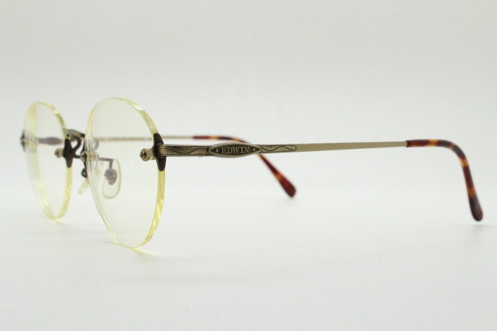 Edwin vintage 90s frameless round eye glasses model 59392A made in Japan. Minimal satin bronze finish optical frame. Prescription RX