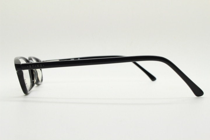 Sting 90s vintage rectangular eye glasses made in Italy. Plain black gloss low profile acetate optical frames. Prescription RX. NOS