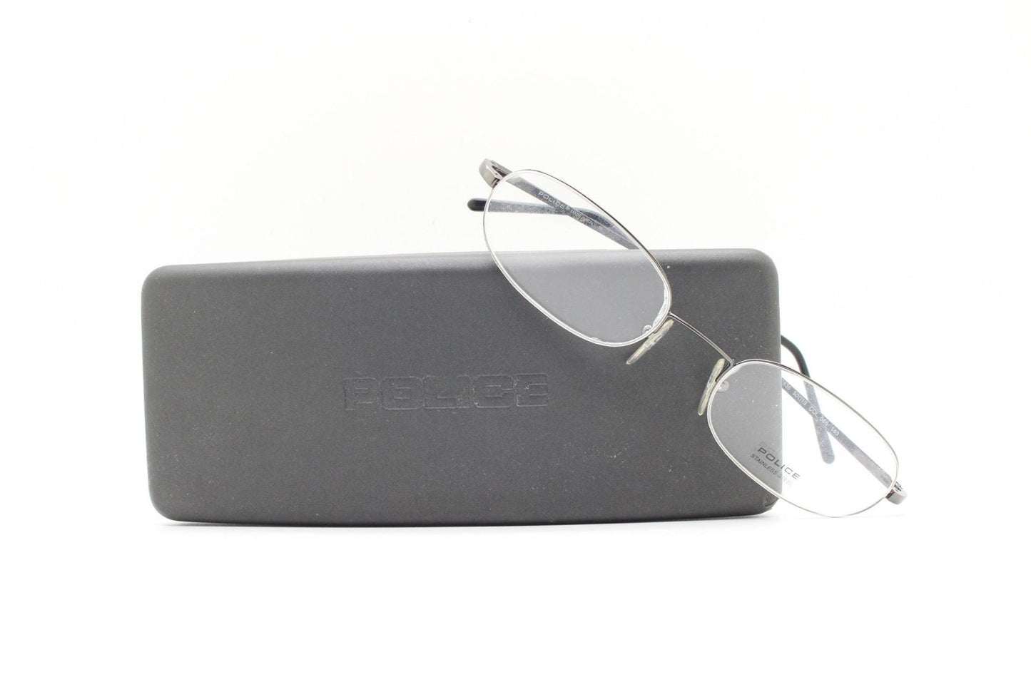 Police 90s vintage oval half rim eye glasses made in Italy. Minimal lightweight optical frame in gunmetal grey. Prescription RX Spectacles