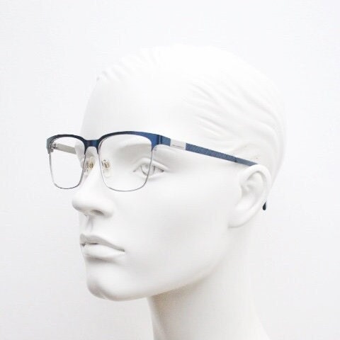 Karl Lagerfeld squared wayfarer shape eye glasses. Navy check pattern arms with satin finish brow optical frames. Prescription eyeglasses.