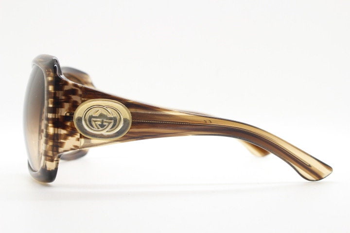 Gucci Y2K vintage oversized square sunglasses made in Italy. Transparent mottled brown frame with glitter sparkles and big stand out logo