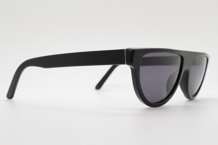 Retrosuperfuture thick flat top cat eye sunglasses hand made in Italy. All black gloss acetate frame. Vintage