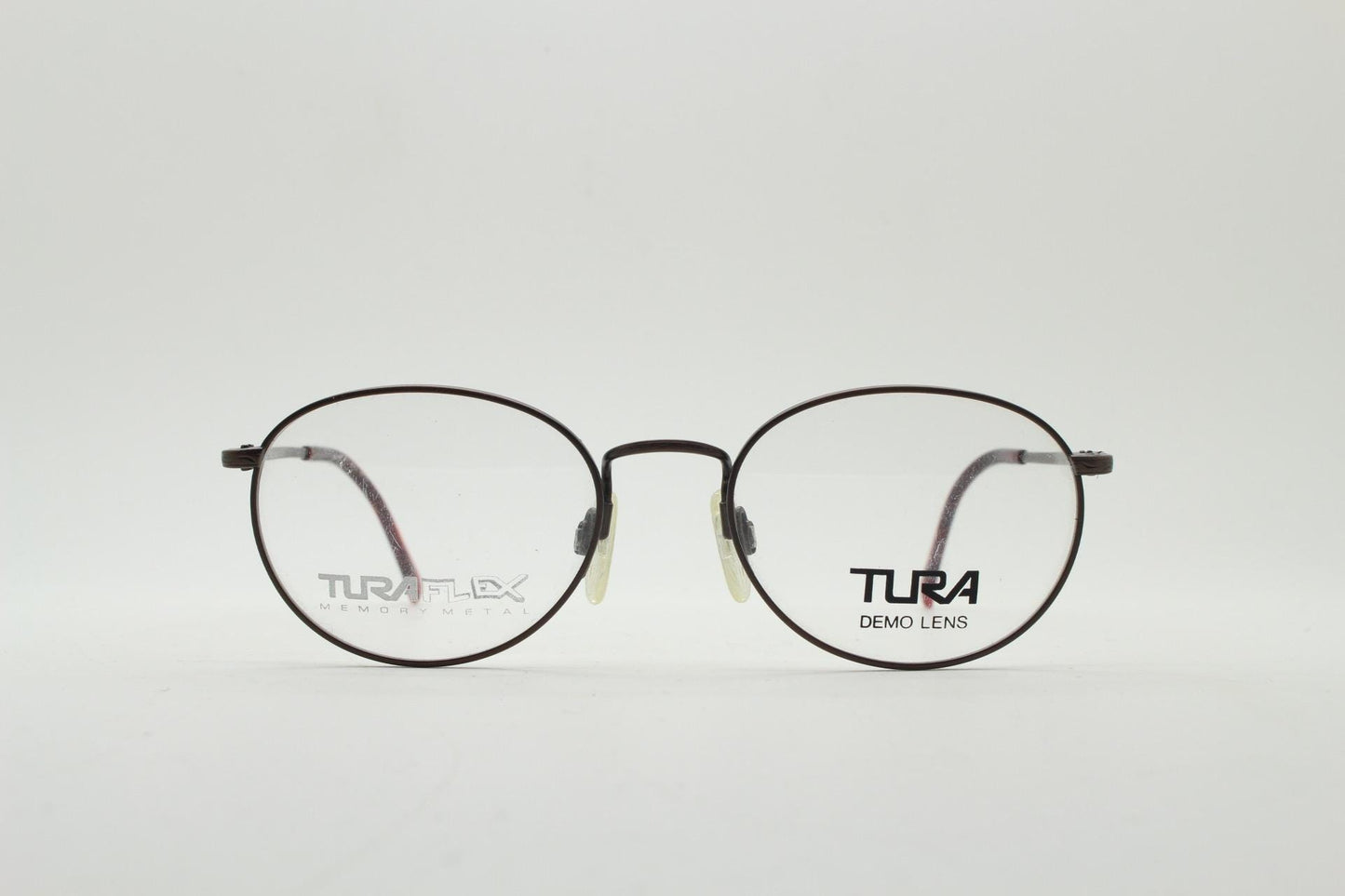 Tura 90s vintage oval eye glasses made in Japan. Satin metallic bronze finish optical frame in neat proportions. Prescription. Unused BNWT