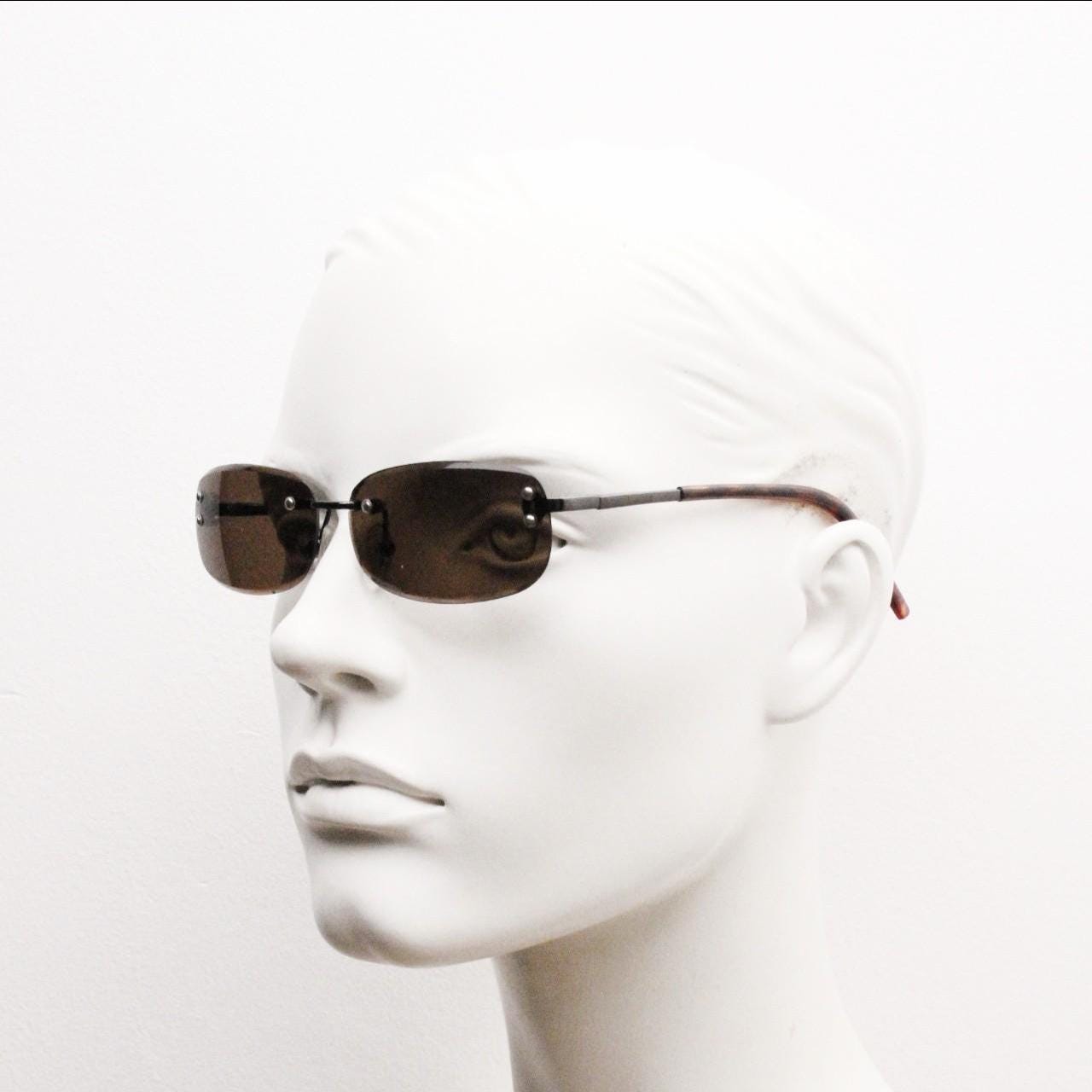 90s vintage minimal frameless sunglasses. Minimal brown rectangular lens with bevelled edges, gunmetal grey trim and tortoise arms. NOS