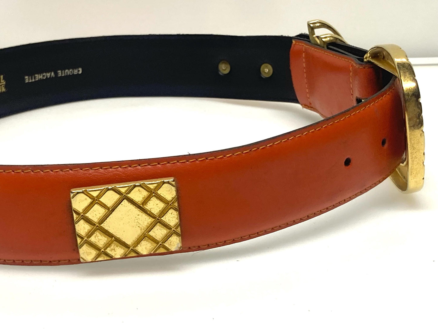 80s vintage womens dress / jeans belt in bright orange leather with golden metal squares. Made in France. Used in good condition