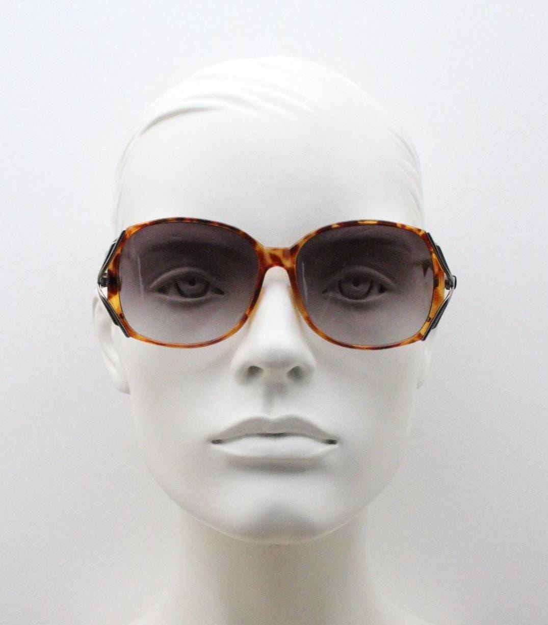 80s vintage square sunglasses. Womens honey tortoise frame with dynamic metal  forked side joints and graduating lenses. 70s. Unused NOS