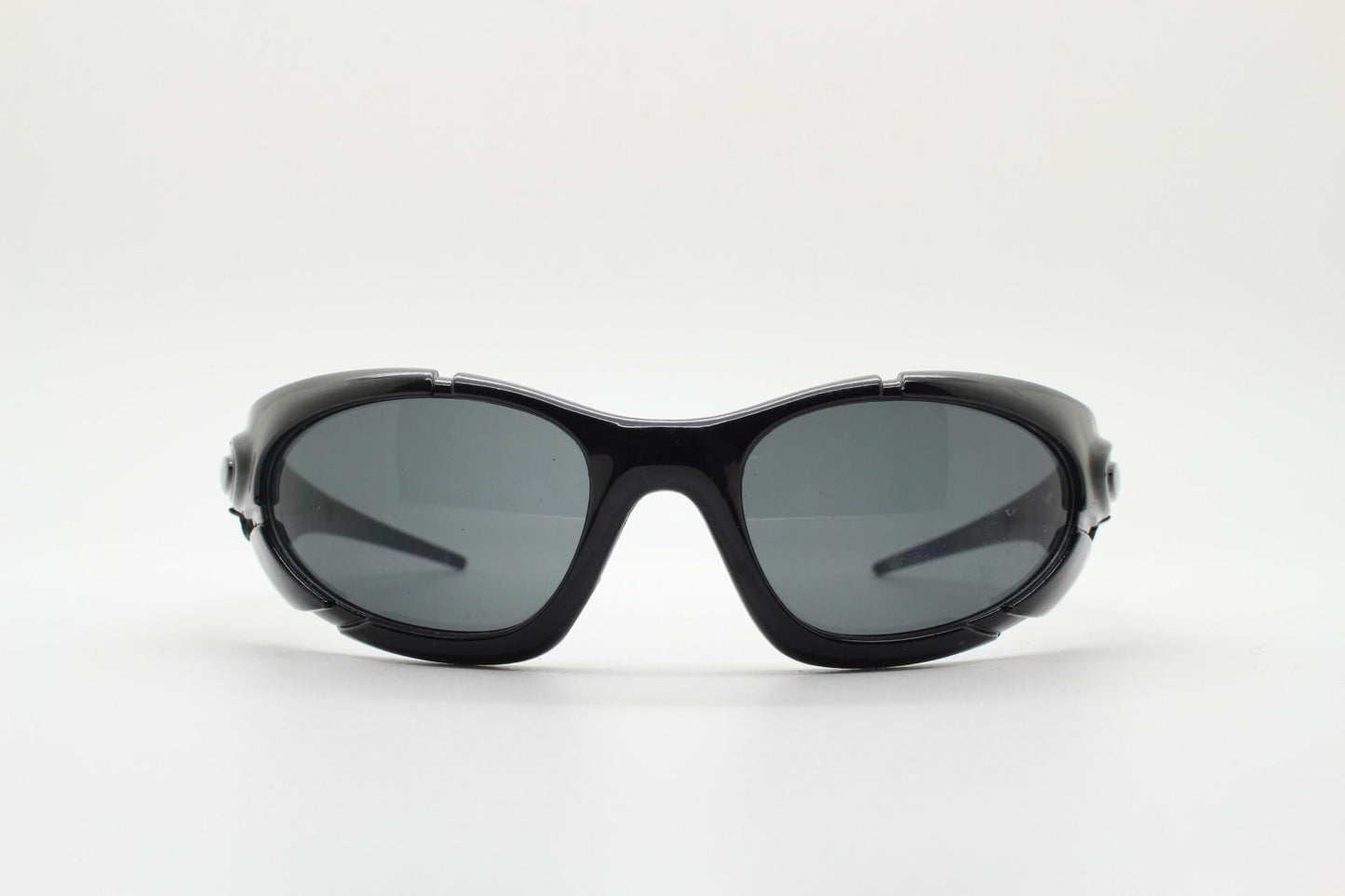 90s vintage sports shield sunglasses. All black gloss aerodynamic wraparound with many stylised features. 2000's. Hells angel uber fashion