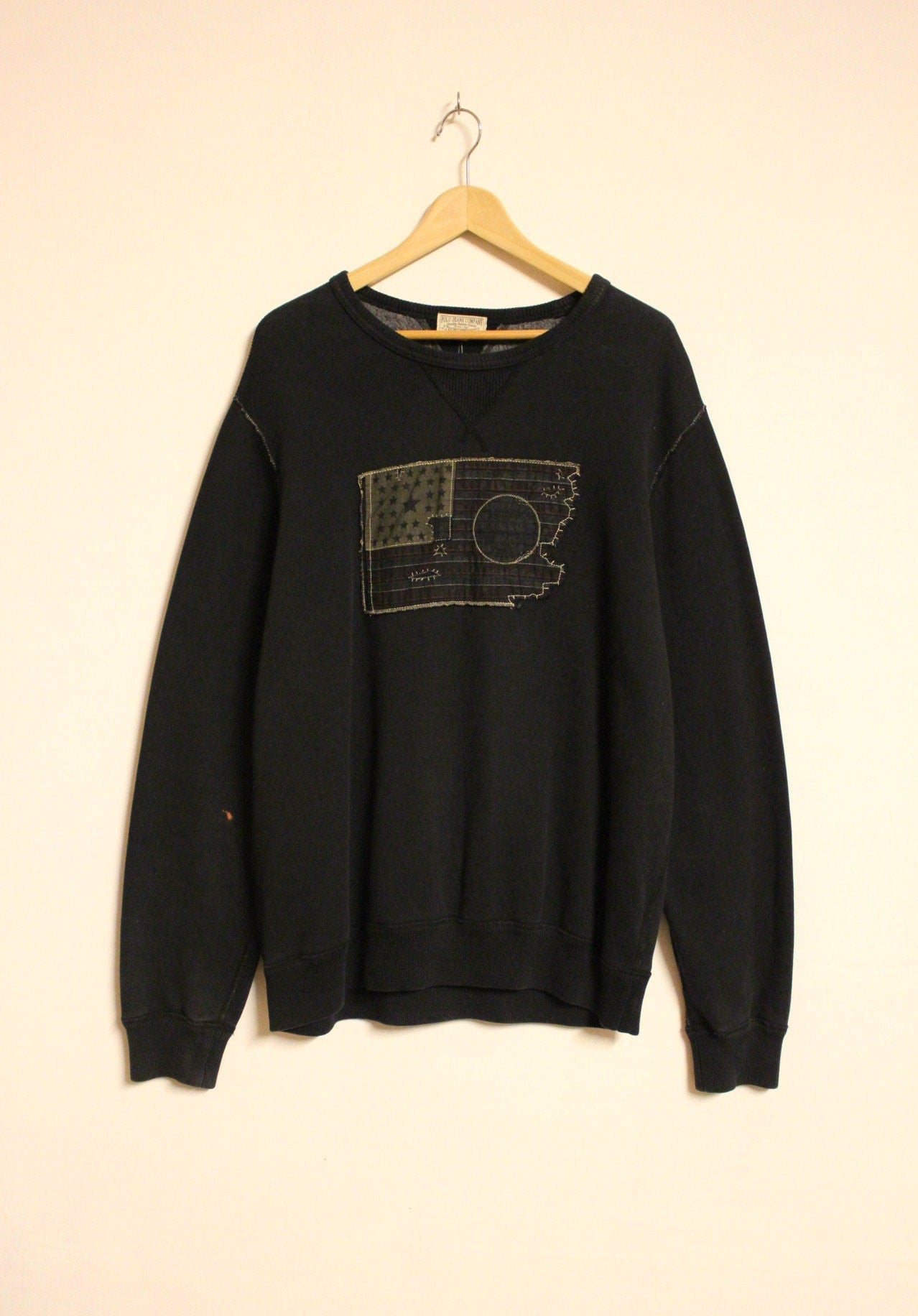 Ralph Lauren Polo Jeans Co. vintage sweatshirt. Black crew neck pullover with distressed US flag patch. Round neck jumper
