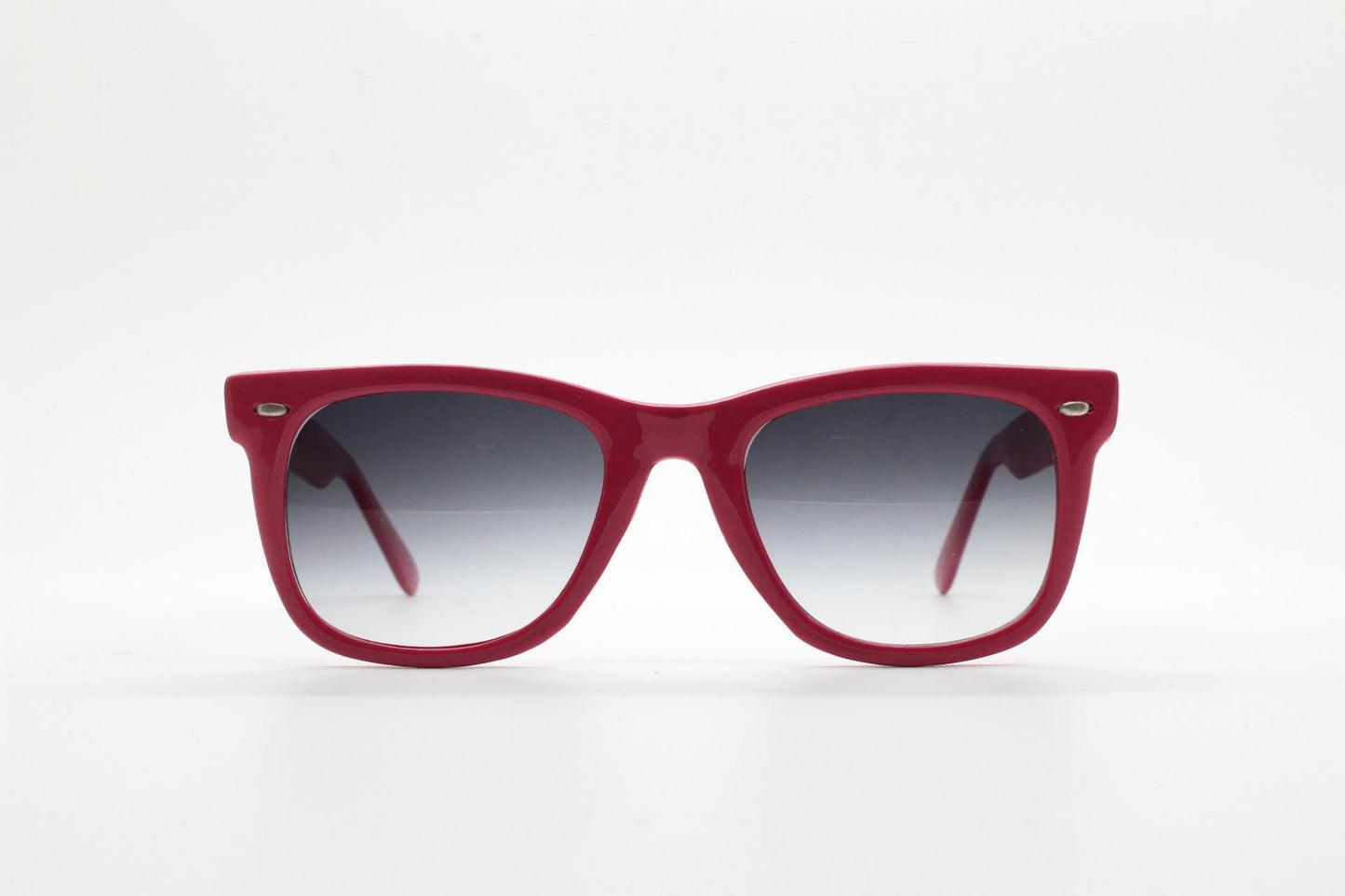 Vintage Y2K wayfarer design sunglasses. All time classic design in glossy pink with graduating smoky black lenses. Excellent NOS condition