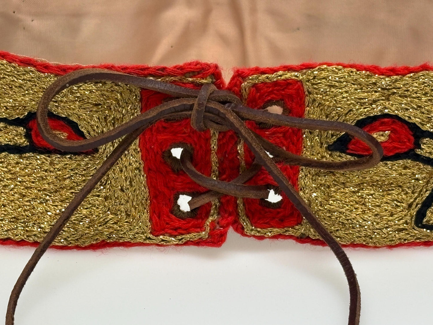 60s vintage completely hand made knitted belt. Embroidered sun, bird and abstract symbols with leather laced tie. Womens unique one off