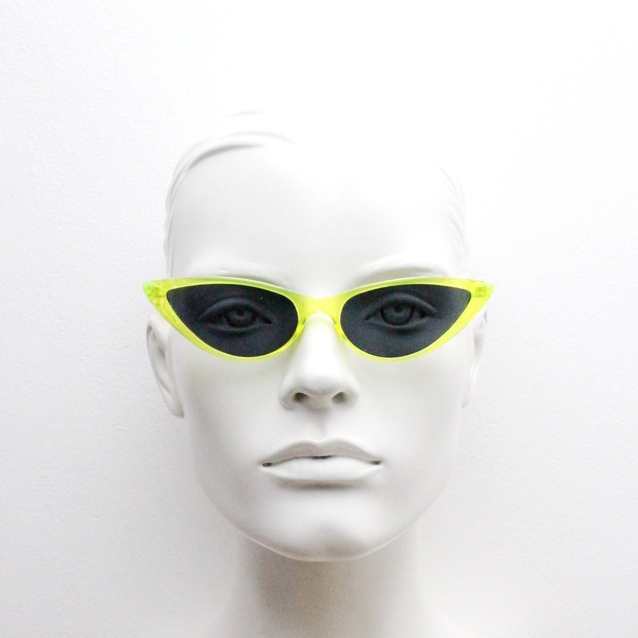 Y2K vintage extreme pointed cat eye sunglasses. Stylised yellow transparent frame with black lenses. Womens 50s style psychabilly. NOS