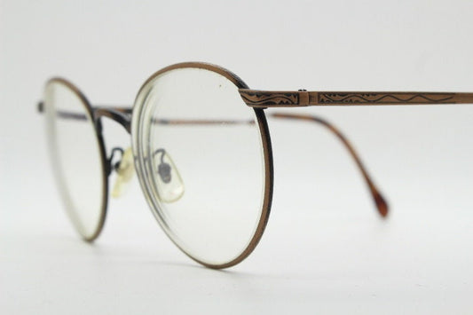 Calvin Klein 90s vintage round panto eye glasses. Brushed bronze optical frames with tooled arm decoration. Prescription eyeglasses. RX