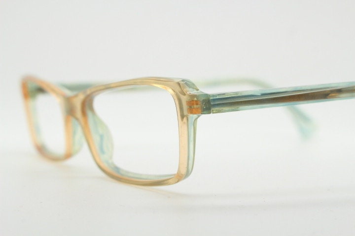 Alain Mikli rectangular eye glasses hand made in France. Low profile slim peach and blue transparent acetate optical frame. Prescription RX.
