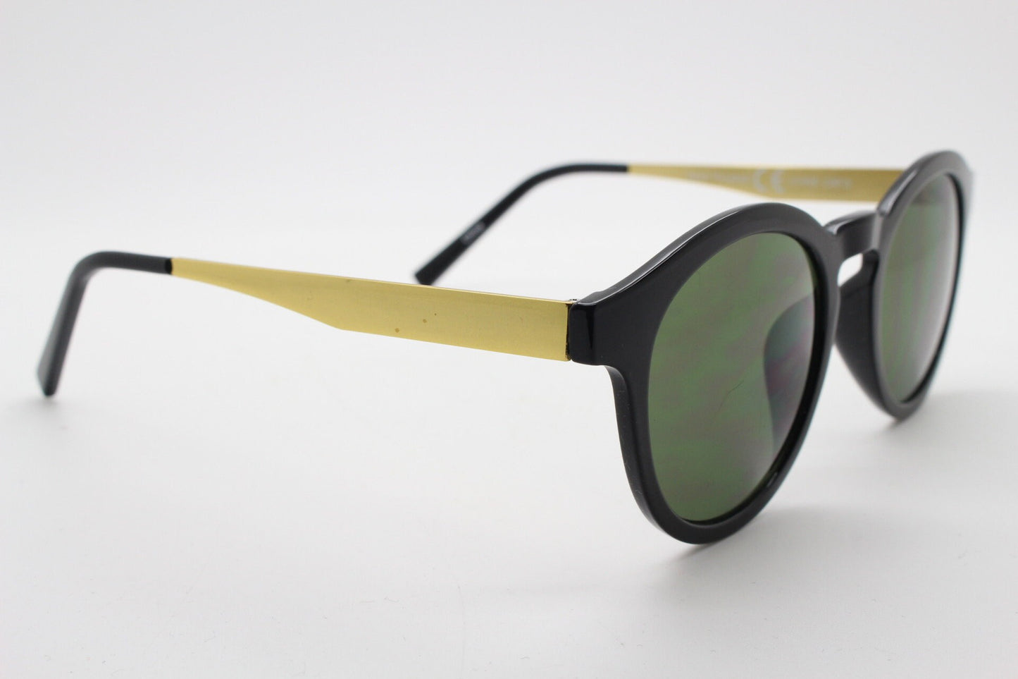 90s vintage round sunglasses. Black gloss frame with contrasting gold arms