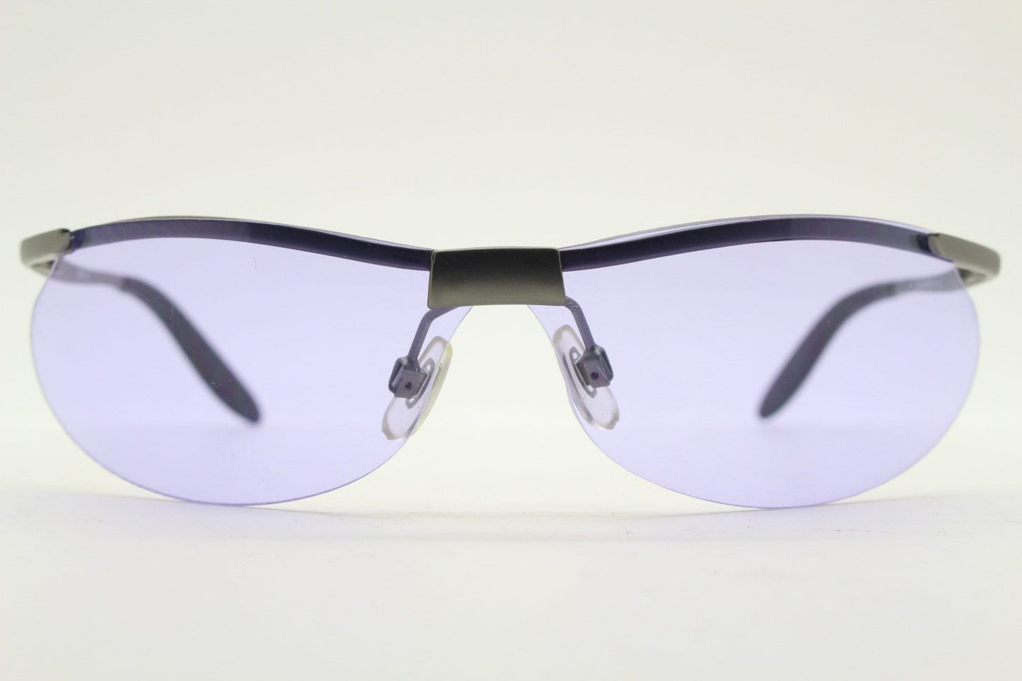 Y2K vintage sport shield sunglasses. 2000's half frame wraparound aerodynamic mini mask visor with purple bug eye lenses. 90s 00s unused NOS