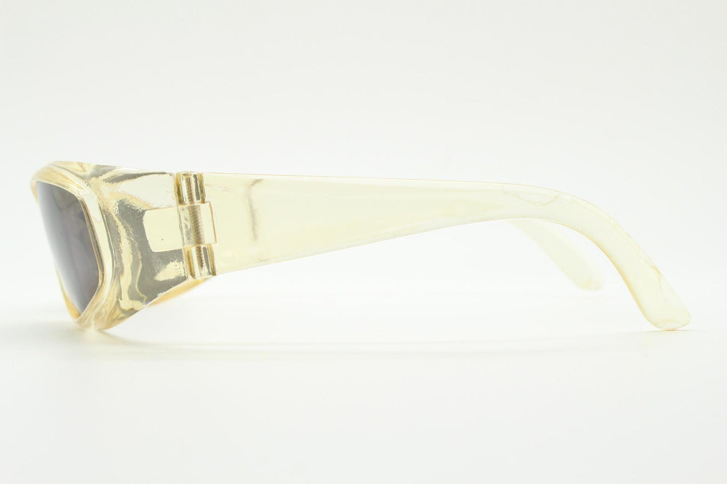 90s vintage sports shield sunglasses. Transparent yellow aerodynamic curved wraparound frame with contrasting black lenses. 2000's rave