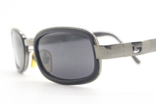 Byblos 90s vintage low profile rectangular sunglasses made in Italy. Gunmetal grey chrome frame with black insets and cut out arm logo's