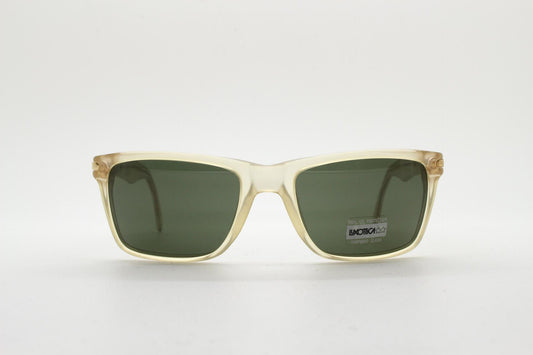Luxottica 90s vintage rectangular sunglasses made in Italy. Transparent yellow acetate chunky frame with contrasting dark green lenses. BNWT