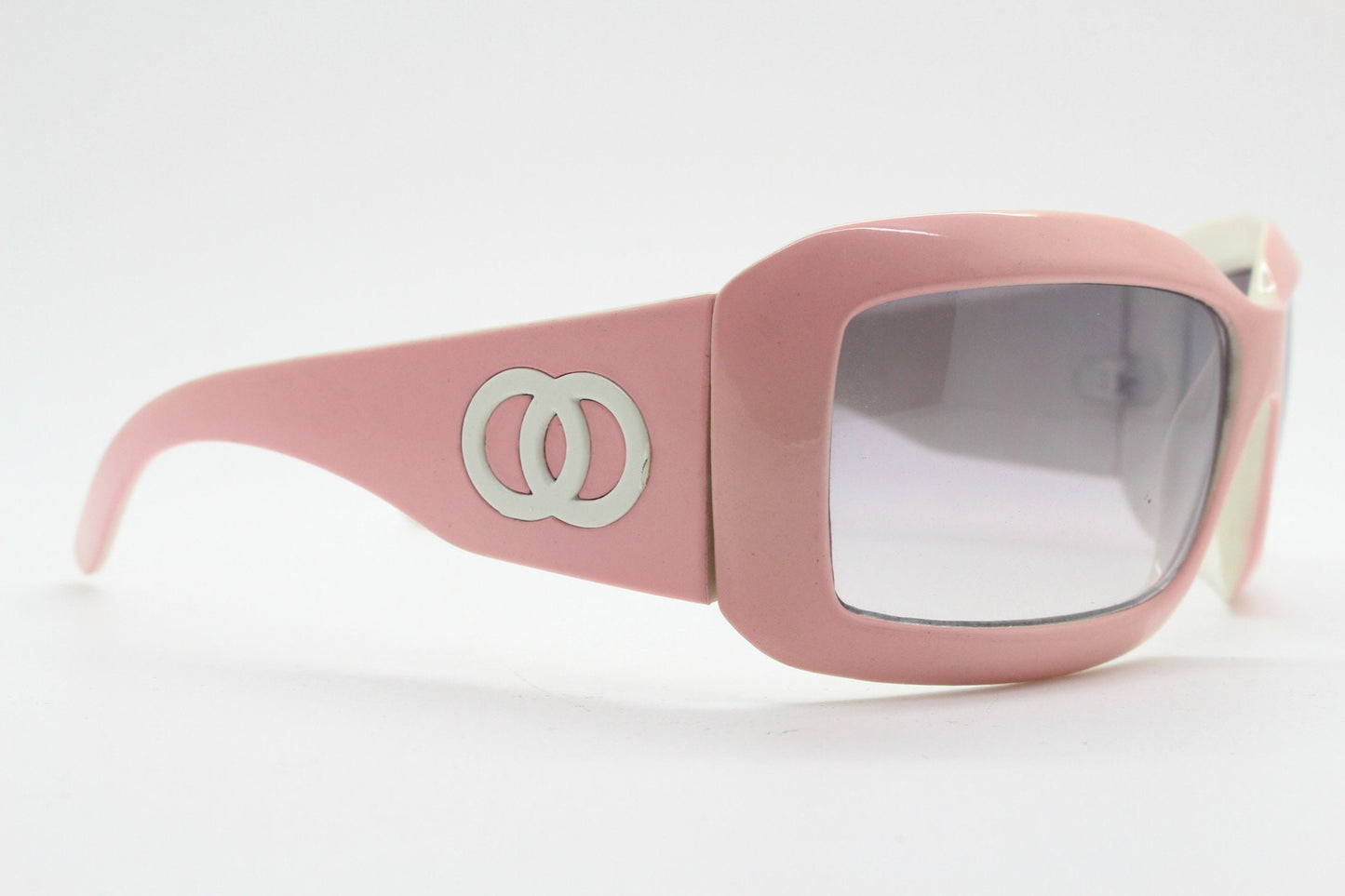 Y2k vintage rectangular wrap around bug eye sunglasses. Curving pink frame with big chain link logo. Rave shield fashion grail. 2000s NOS