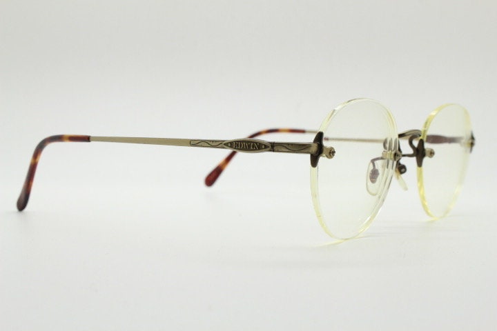 Edwin vintage 90s frameless round eye glasses model 59392A made in Japan. Minimal satin bronze finish optical frame. Prescription RX