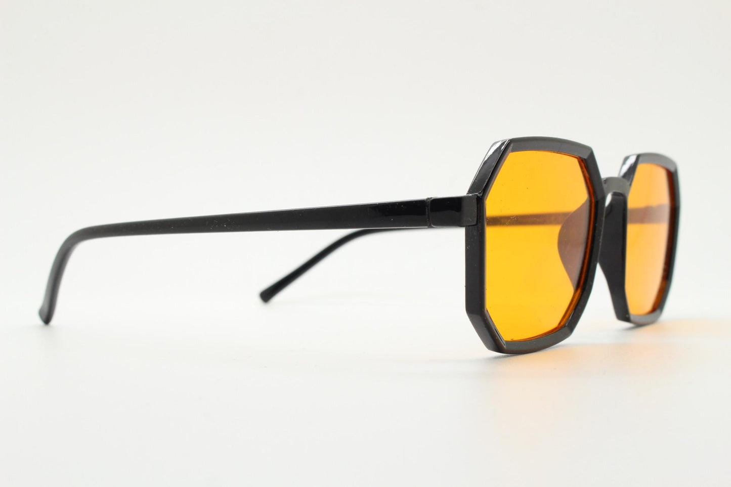 Vintage octagon sunglasses. Well proportioned subtle 8 sided black gloss frame with intense orange lenses. Rave. BNWT. NOS