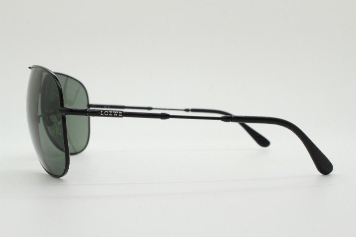 Loewe vintage aviator sunglasses in a tall black gloss frame with dark green lenses. Mens large teardrop pilot aviators. Y2K New Old Stock