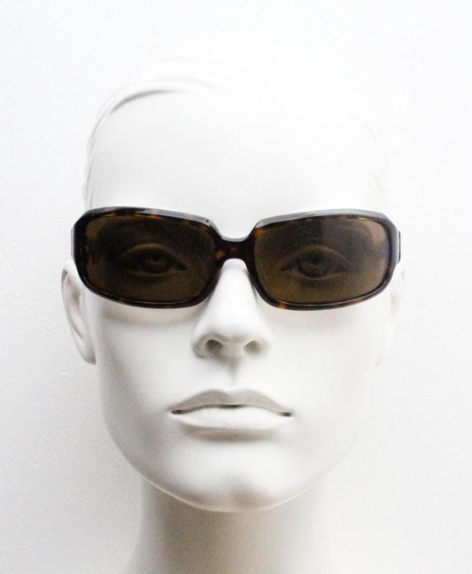 Oliver Peoples vintage Y2K wrap around sunglasses model Impala made in Japan. Curved bug eye in mottled brown tortoise acetate