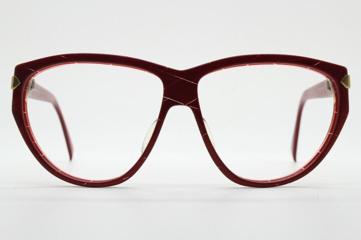 Silhouette 80s vintage oversized cat eye glasses made in Austria. Dramatic red prescription optical frame with subtle criss cross stripes RX