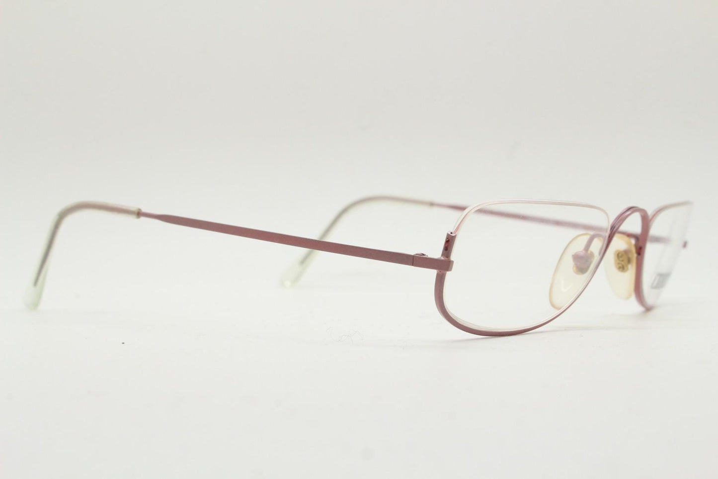 Cerruti 1881 half moon eye glasses. Pink half frame optical eyeglasses. Undulating C bridge design. 90s vintage prescription spectacles. NOS